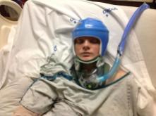 Tori in her traveling safety helmet. When she sees this, she will die. Blue was the color I chose.